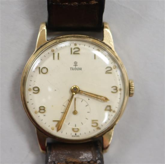A gentlemans 9ct gold Tudor wrist watch.